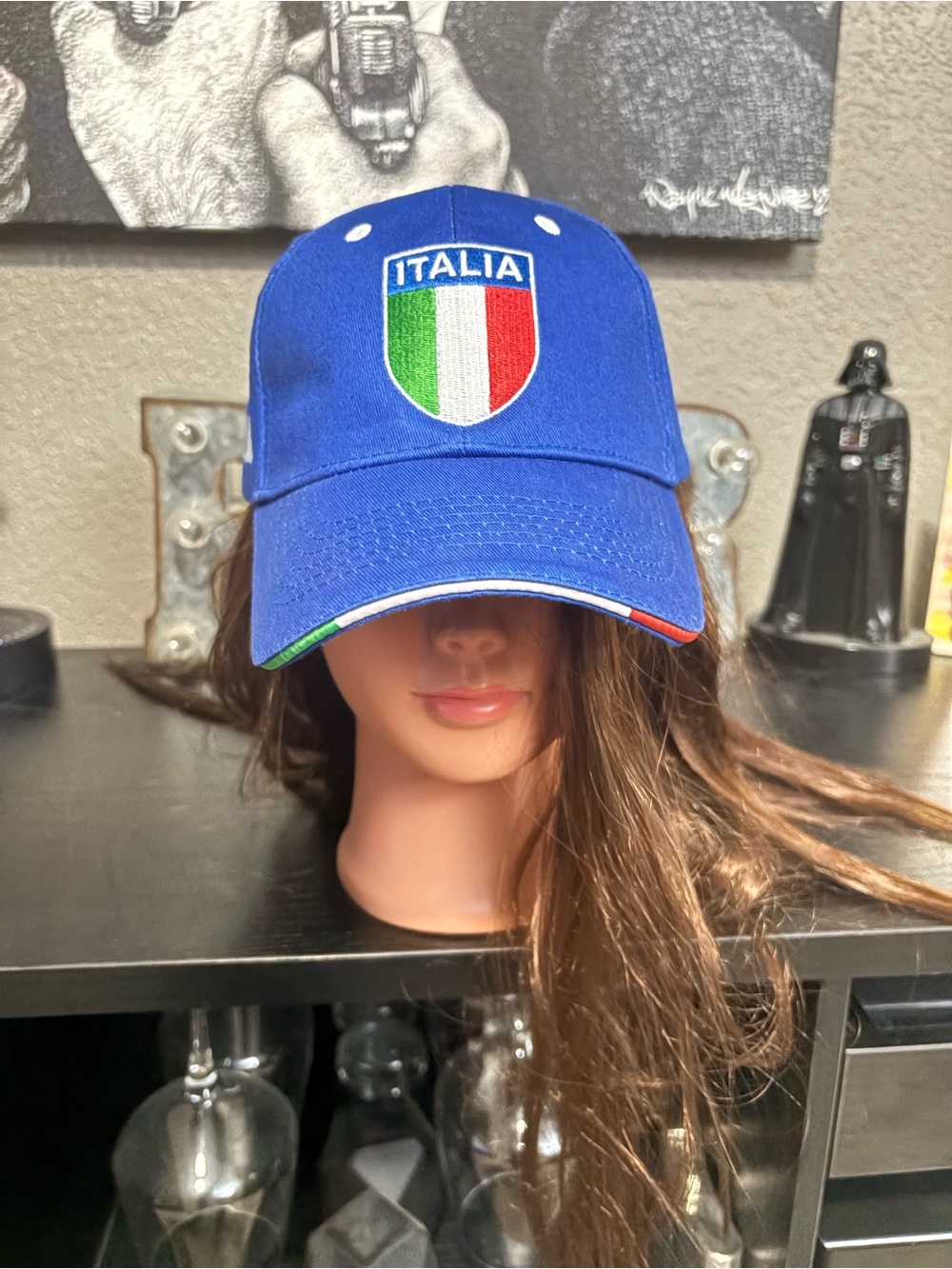 Italia Shield Blue Baseball Cap with Italian Flag Trim. Velcro closure one size.
